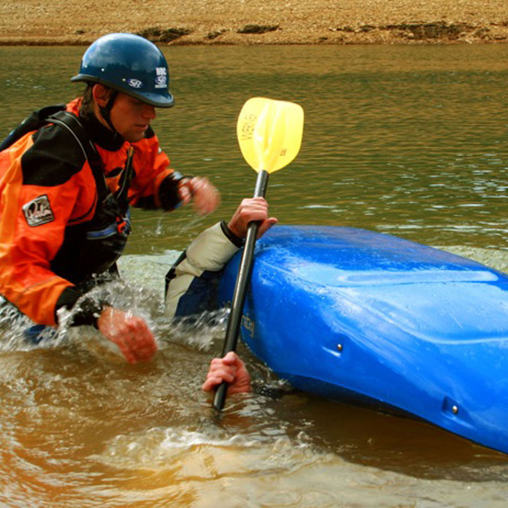 A man in orange prepares to rescue someone who has flipped upside down in a blue kayak