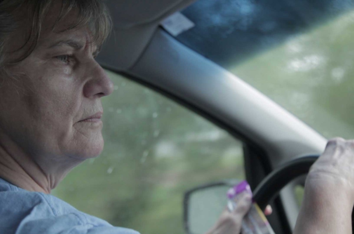 Mary drives to pick up her two grandsons and their friends at school after her tai chi class.