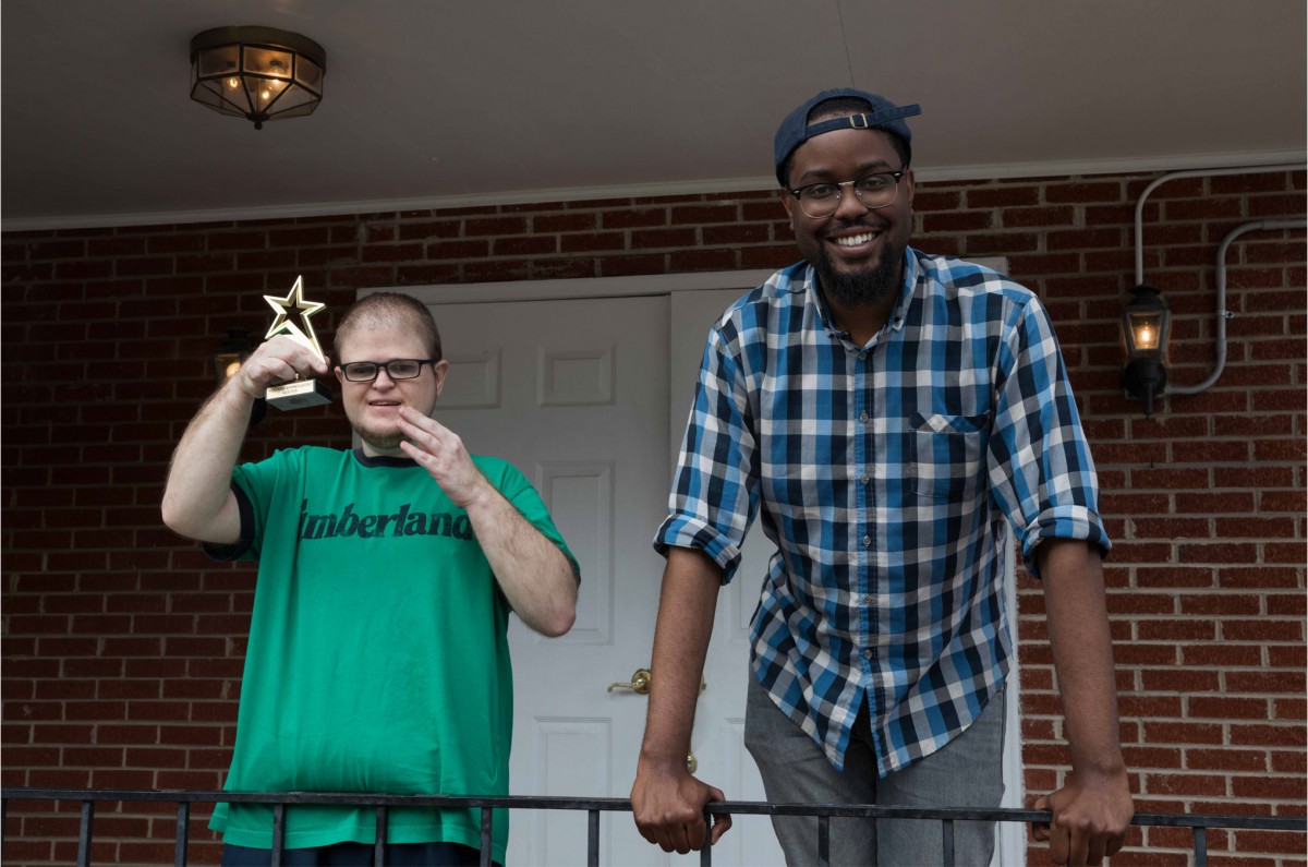 Harper and Kester pose with the award Kester received for his volunteer work in the community. They volunteer together at least twice a week at local churches and thrift stores.