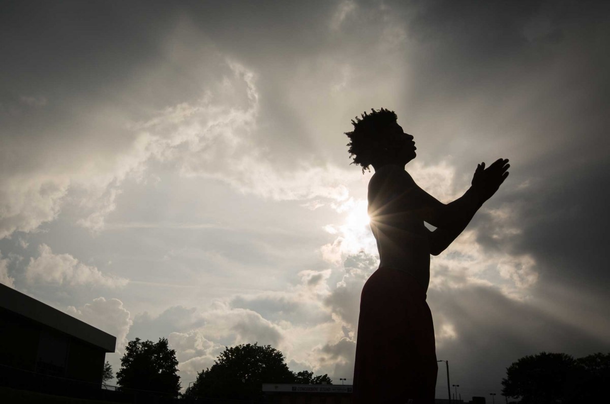 Dre walks on the sidelines of the football field at Hickory High School. Rhinehart played as a reciever for his school football team  and will graduate this June. | 05.17.2018