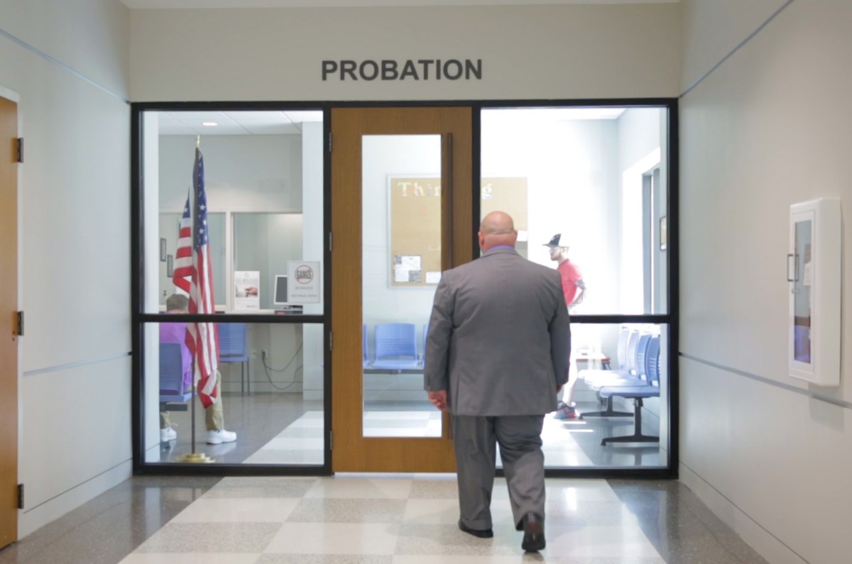 Chad Ledford walks into the probation office of the court house in Hickory, NC. He has to send money there once a month, and is on probation for five years.
