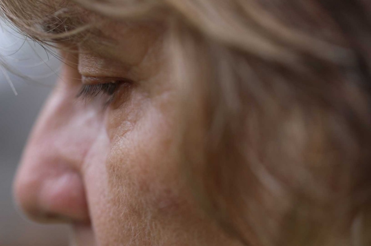 Mary slows her breathing before beginning her practice.