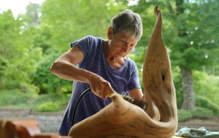 woman carving wood