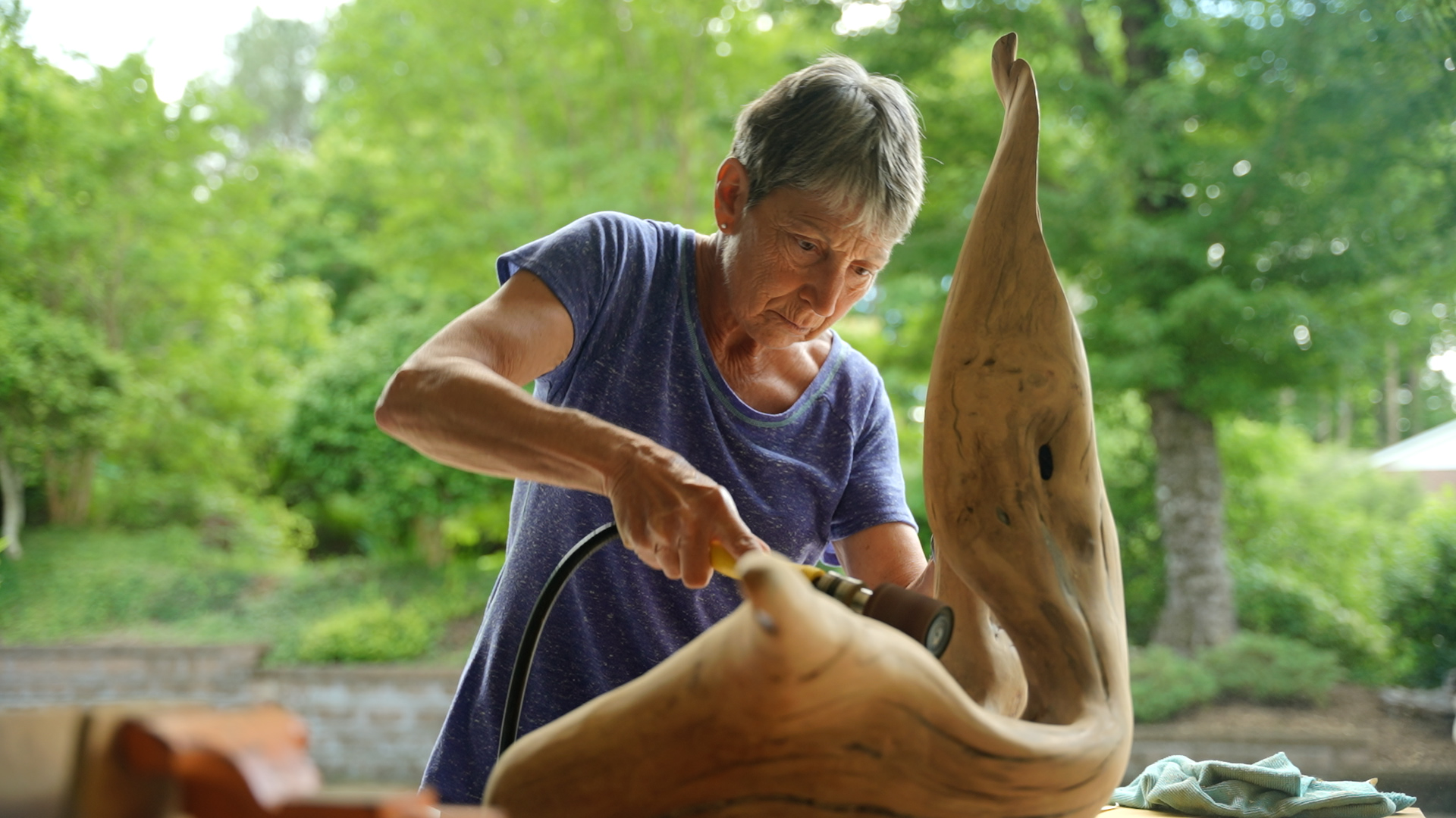 woman carving wood