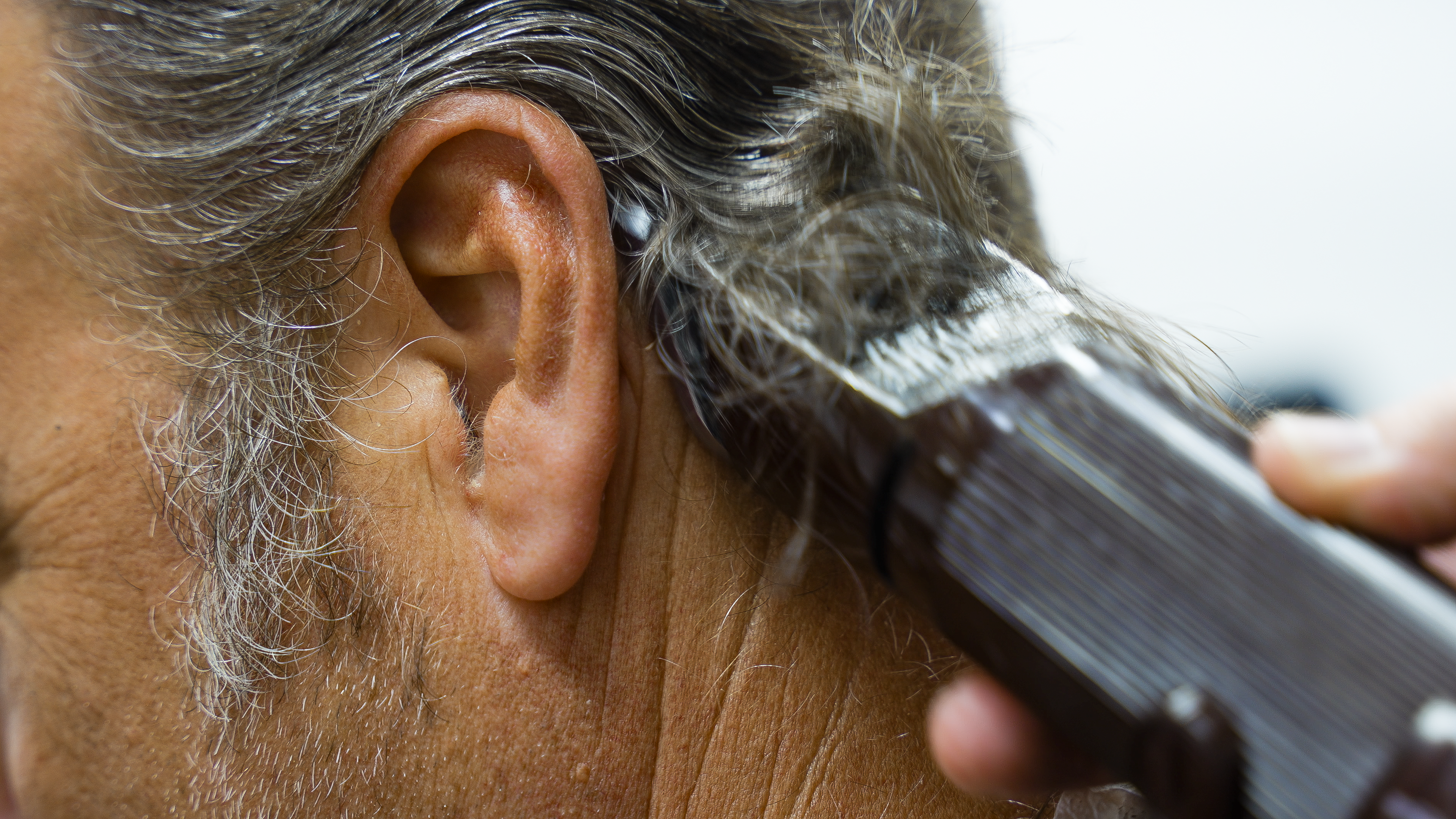 man getting his hair cut