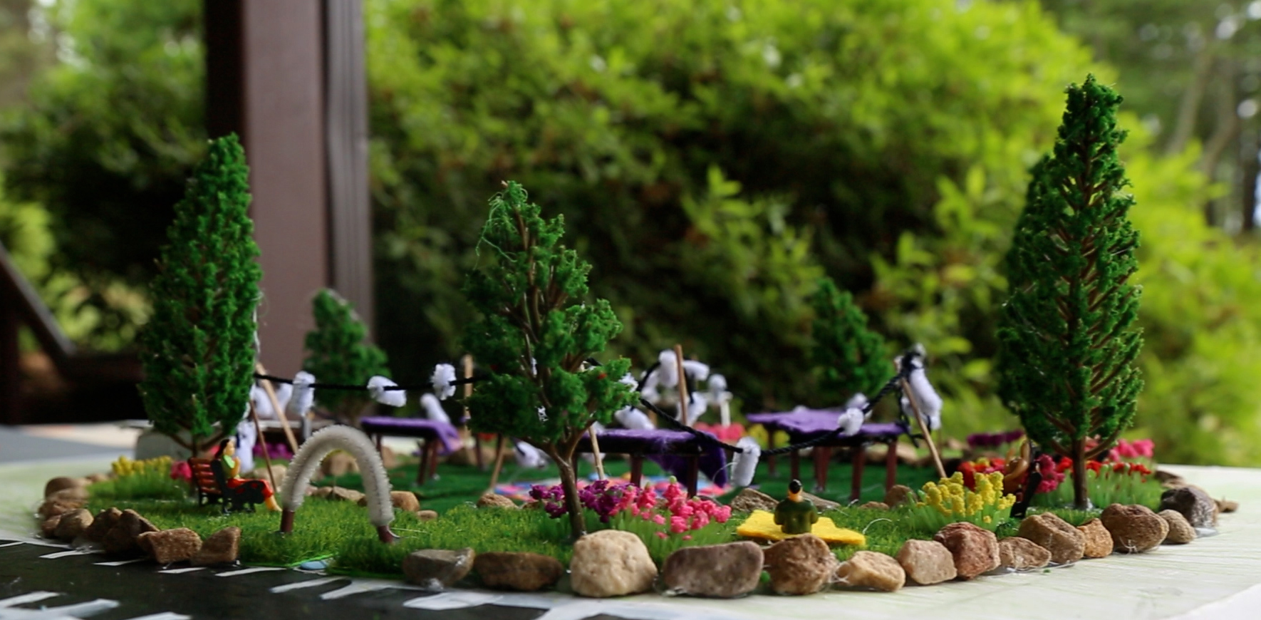 A student’s model of a community garden sits on display moments before parents arrive to hear final presentations.