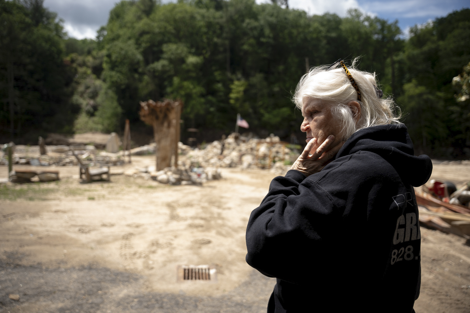 Visiting a Chimney Rock resident, Schneider views the devastation the hurricane left behind.