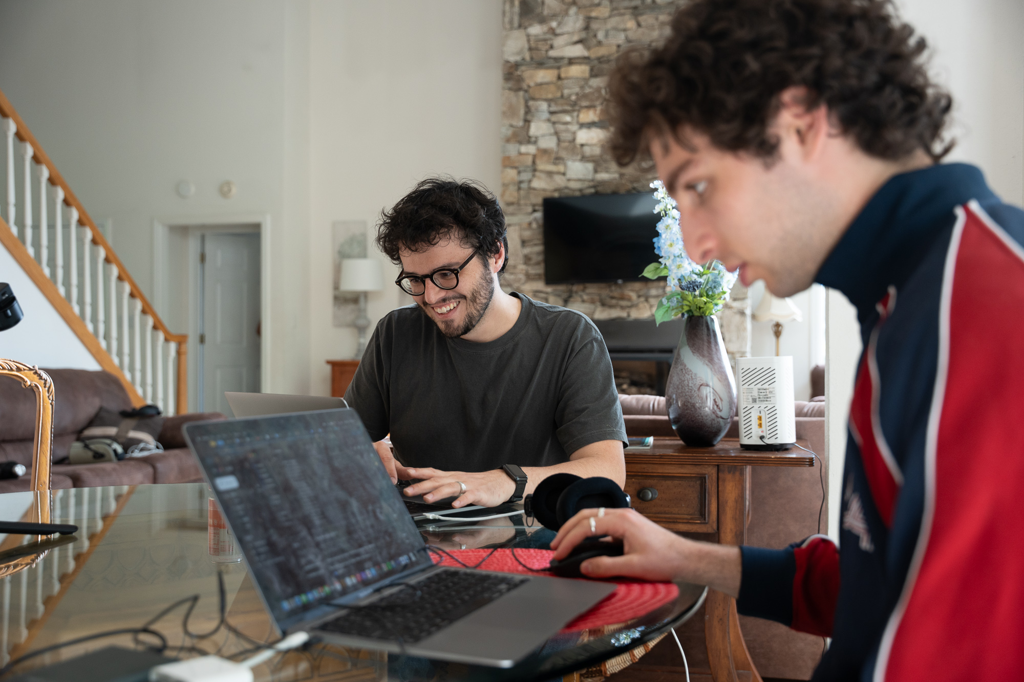 Rob Gourley smiles proudly about his work he is was near to finishing with while Nick Baumstein worked intensely on his computer.